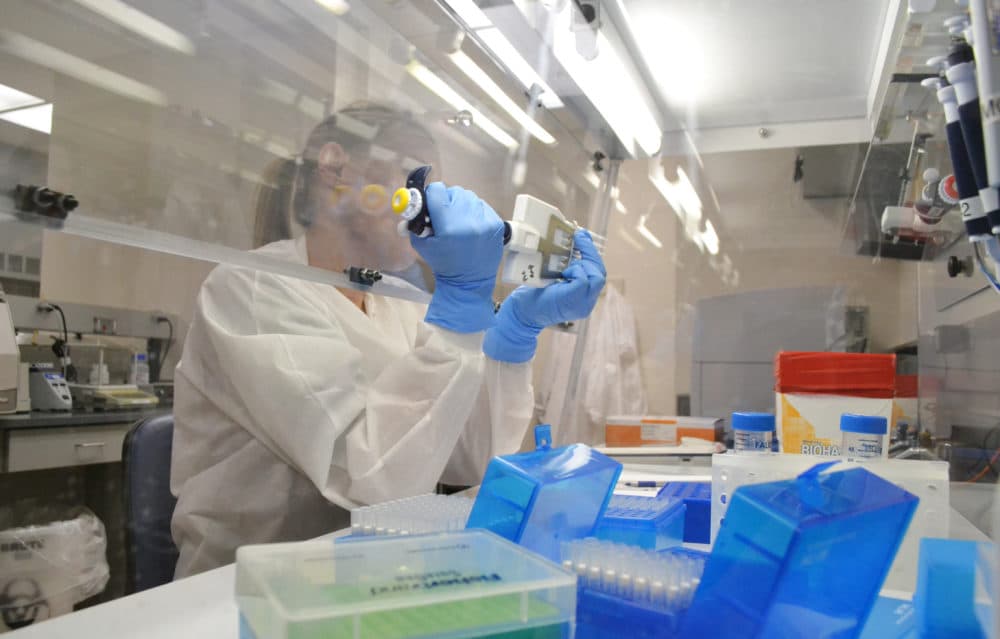 In this April 12, 2018 photo lab technician extracts DNA for whole genome sequencing at the Colorado Department of Public Health & Environment’s Molecular Science Laboratory in Denver. Some experts say the new DNA testing is revolutionizing the way disease detectives to identity and solve food poisoning outbreaks. (AP Photo/P. Solomon Banda)
