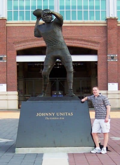 Rich Ellenson -- circa 2004? -- with the statue of Johnny Unitas outside the Baltimore Ravens stadium. (Courtesy Rich Ellenson)