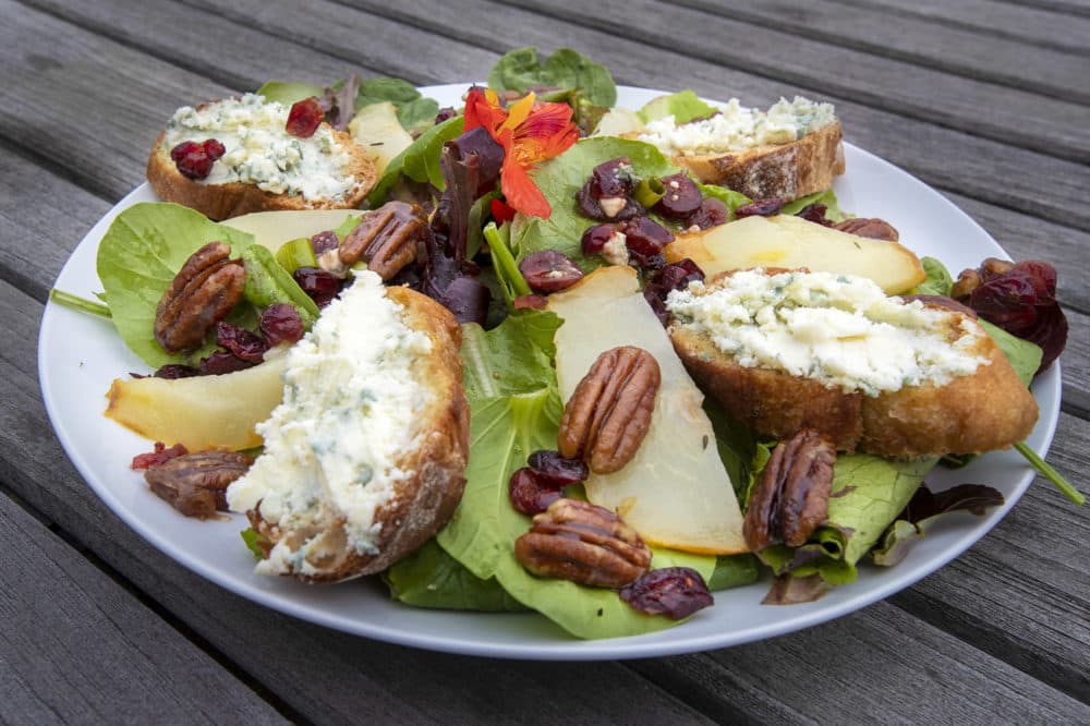 Spinach salad with roasted pears, blue cheese toasts and caramelized maple pecans with sun-dried cranberry vinaigrette. (Jesse Costa/WBUR)