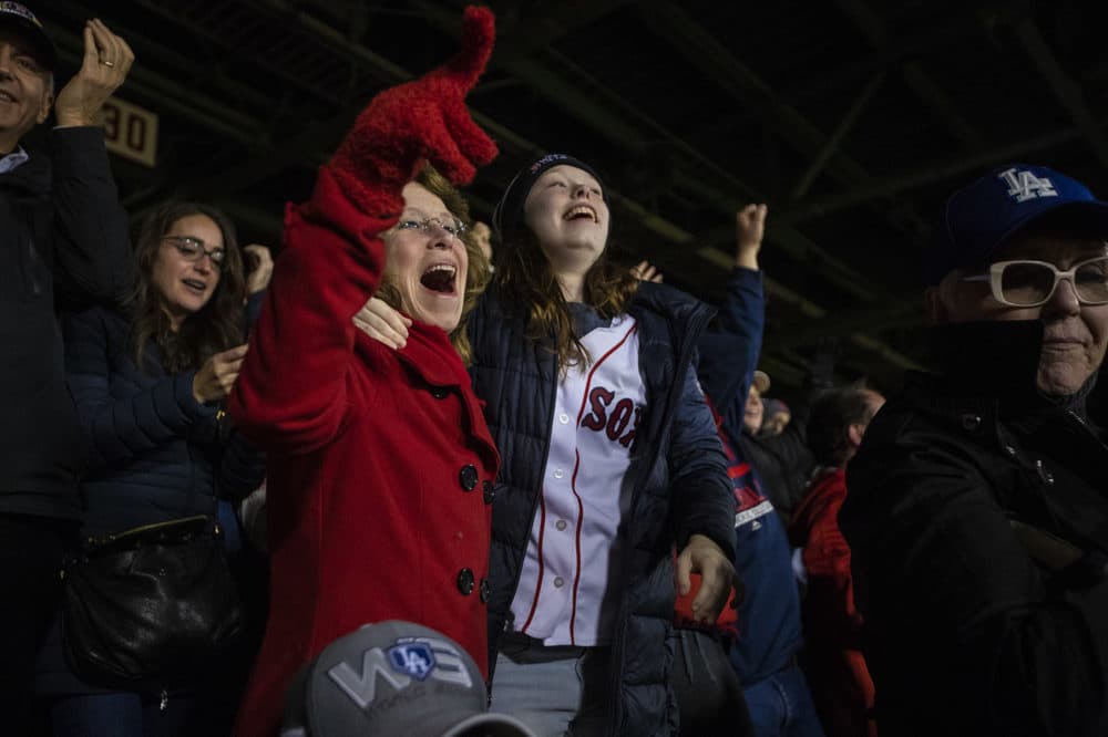 Red Sox fans react to Eduardo Núñez’s three-run homer in the seventh inning to put the Red Sox up 8-4 over the Dodgers. (Jesse Costa/WBUR)