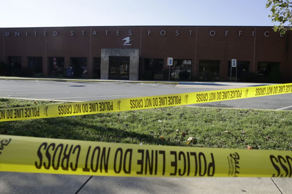 Police tape cordons off a post office in Wilmington, Del., Thursday, Oct. 25, 2018. A law enforcement official said suspicious packages addressed to former Vice President Joe Biden were intercepted at Delaware mail facilities in New Castle and Wilmington and were similar to crude pipe bombs sent to former President Barack Obama, Hillary Clinton and CNN. (Matt Rourke/AP)
