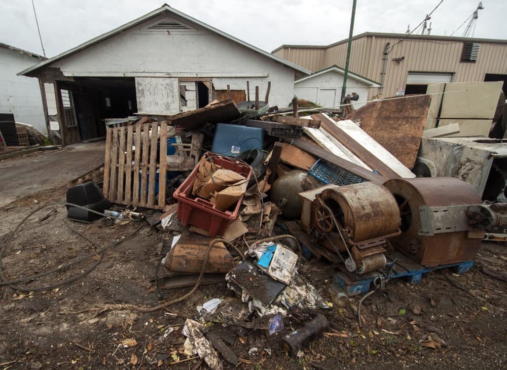 Debris in front of 13 Mile Seafood in Apalachicola, Fla. (Chris Bentley/Here & Now)