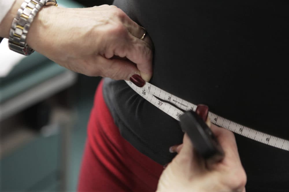 FILE - In this Jan. 20, 2010, file photo, a waist is measured during an obesity prevention study in Chicago. (AP Photo/M. Spencer Green, File)