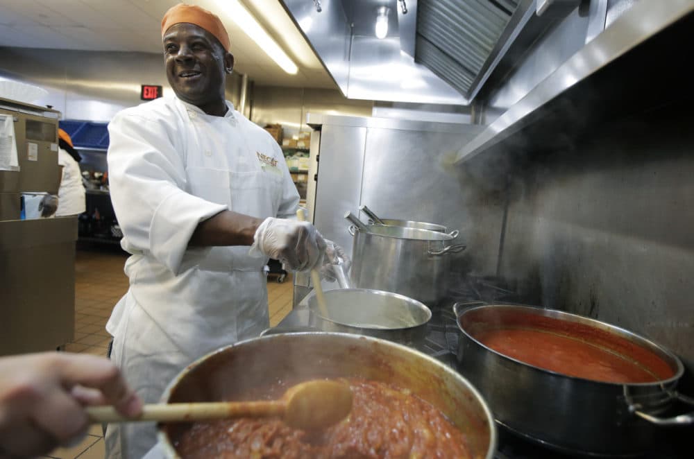 In this Tuesday, Oct. 2, 2018 photo Phillip Oliver, of New Bedford, Mass., in recovery from opioid addiction, prepares a meal in a culinary training program at the New England Center for Arts and Technology, in Boston. (Steven Senne/AP)