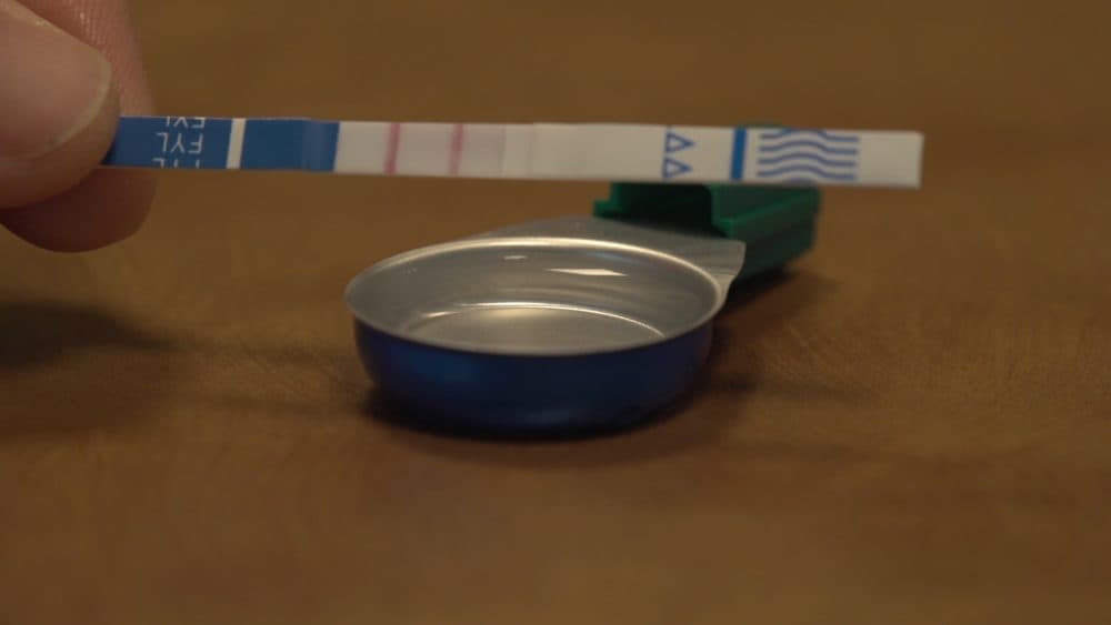 Max Krieger, a research assistant and the lead author of the study, illustrates how to use the fentanyl test strips. (Courtesy Stephen Crocker/Brown University)