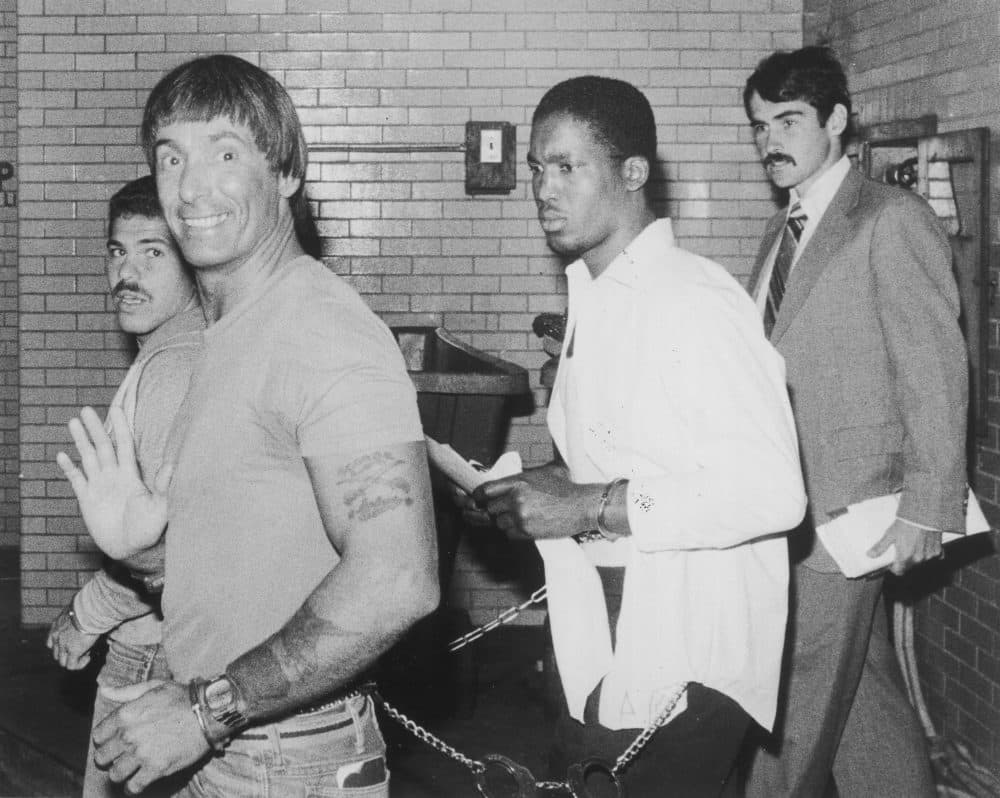 George Reissfelder waves to photographers as he arrives at Suffolk Superior Court on Aug. 30, 1982. (Courtesy Joe Runci/Boston Globe)