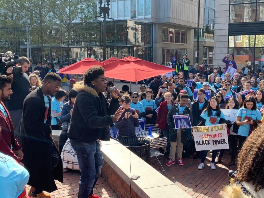 Protesters gather in Harvard Square in Cambridge on Sunday, Oct. 14, 208. (Simón Rios)