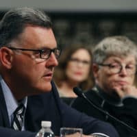 Steve Penny, former president of USA Gymnastics, pleads the Fifth, while seated next to Lou Anna Simon,(R), former president of Michigan State University, during a Senate Commerce, Science and Transportation Committee hearing, on June 5, 2018 in Washington, DC. Penny was arrested this week and charged with evidence tampering. Mark Wilson/Getty Images)