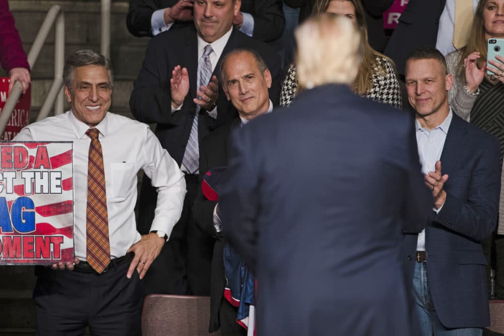 FILE - In this Dec. 15, 2016, file photo, U.S. Rep. Lou Barletta, R-Pa., left, U.S. Rep. Tom Marino, R-Pa., center left, and U.S. Rep. Scott Perry, R-Pa., right, watch as President-elect Donald Trump, center right, departs a rally in Hershey, Pa. The Democratic-controlled Pennsylvania Supreme Court struck down the state's congressional map in a 4-3 decision Monday, Jan. 22, 2018, granting a major victory to Democrats who charged that the 18 districts were unconstitutionally gerrymandered to benefit Republicans. (AP Photo/Matt Rourke, File)
