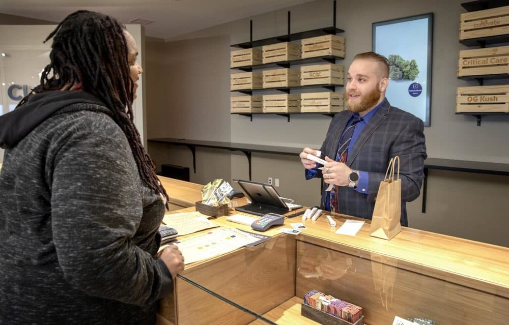 Mike Lasar serves a customer at Cultivate. (Robin Lubbock/WBUR)