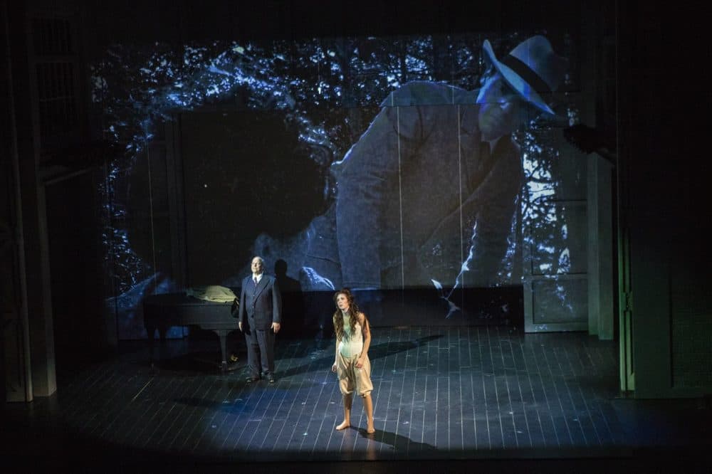 Sara Womble portrays the girl and Omar Ebrahim as Schoenberg in a scene of "Schoenberg In Hollywood" during a dress rehearsal at the Paramount Theater. (Jesse Costa/WBUR)