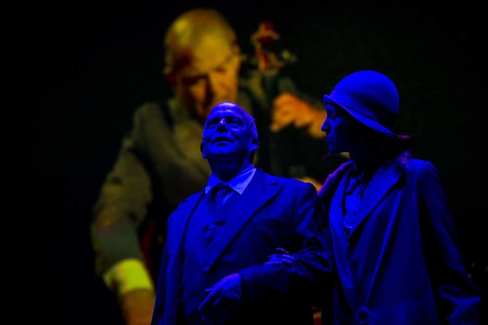 Sara Womble portrays the girl and Omar Ebrahim as Schoenberg in a scene of "Schoenberg In Hollywood" during a dress rehearsal at the Paramount Theater. (Jesse Costa/WBUR)