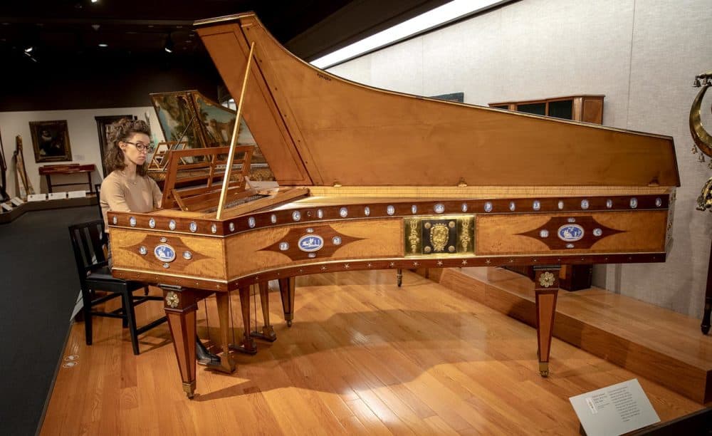 Musician Martina Wlodarczyk plays a harpsichord at the MFA. The instrument was made in France, probably in 1736. (Robin Lubbock/WBUR)
