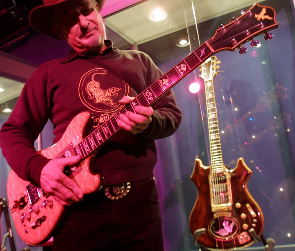 Guitar-maker Doug Irwin strums Wolf, an electric guitar he custom-made for the late Jerry Garcia, at Studio 54 in 2002 in New York. (Tina Fineberg/AP)