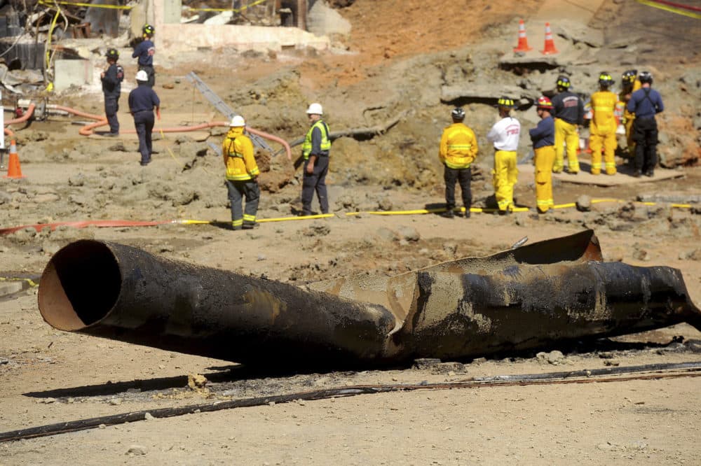 In this Sept. 11, 2010, file photo, a natural gas line lies broken on a San Bruno, Calif., road after a massive explosion. A federal jury found Pacific Gas &amp; Electric Co., California's largest utility, guilty on Tuesday, Aug. 9, 2016, of misleading investigators about how it was identifying high-risk pipelines after the deadly gas line explosion in the San Francisco Bay Area. (AP Photo/Noah Berger, File)