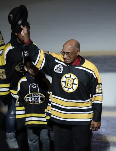Former Boston Bruins wing Willie O'Ree tips his hat as he is honored prior to a game against the Montreal Canadiens in Boston on Jan. 17, 2018. O'Ree broke the NHL's color barrier 60 years ago while playing a game against the Canadiens in 1958. (Charles Krupa/AP)