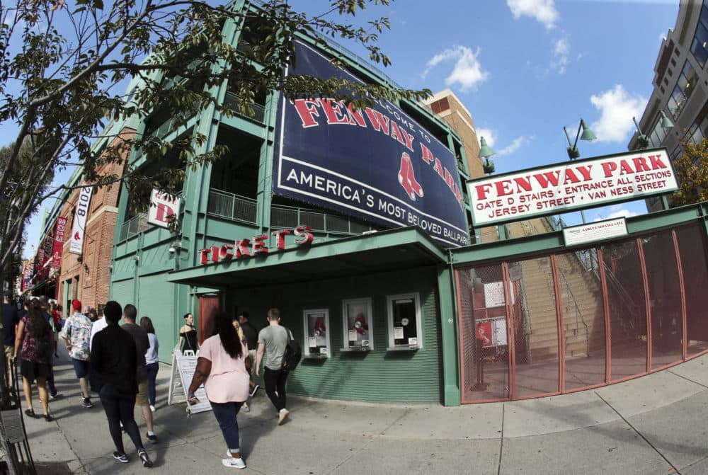 A tour group walks outside Fenway Park, Wednesday, Oct. 10, 2018, in Boston. (Elise Amendola/AP)