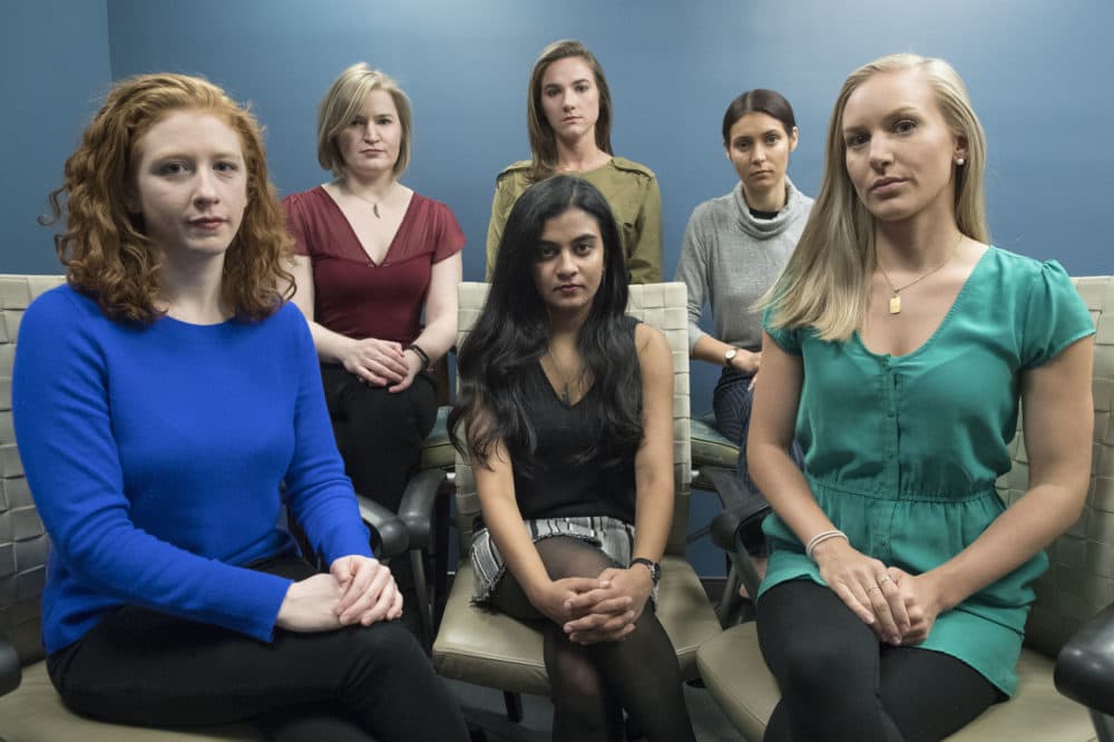 In this Wednesday, Nov. 14, 2018 photo from left back row, Annemarie Brown, Andrea Courtney, and Marissa Evansin, and from left front row, Sasha Brietzke, Vassiki Chauhan, Kristina Rapuano, pose in New York. The women filed a lawsuit against Dartmouth College for allegedly allowing three professors to create a culture in their department that encouraged drunken parties and subjected female graduate students to harassment, groping and sexual assault. (AP Photo/Mary Altaffer)