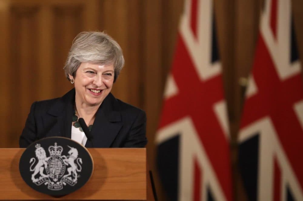Britain's Prime Minister Theresa May smiles during a press conference inside 10 Downing Street in London, Thursday, Nov. 15, 2018. British Prime Minister Theresa May says if politicians reject her Brexit deal, it will set the country on "a path of deep and grave uncertainty." Defiant in the face of mounting criticism, May said Thursday she believed "with every fiber of my being" that the deal her government struck with the European Union was the right one. (Matt Dunham, Pool/AP)