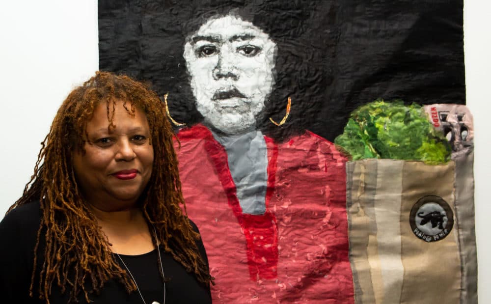 L’Merchie Frazier with her mixed media quilt which depicts Black Panther Party activist Ericka Huckins (Courtesy Melissa Blackall and Cooper Gallery of African and African American Art)