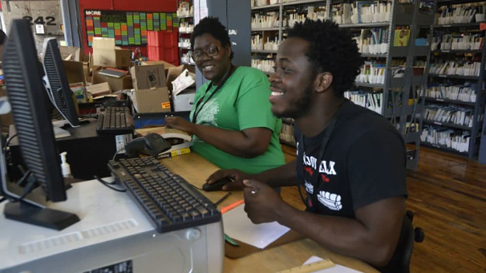 Shanaya King, left, works alongside a fellow More Than Words employee. (Courtesy of More Than Words)
