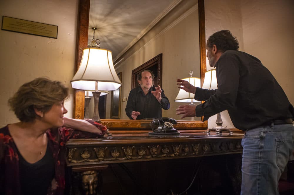 Actor Jeremiah Kissel recites lines from "A Christmas Carol" in the mirror Charles Dickens used to rehearsal during his stays at the Parker House in Boston. (Jesse Costa/WBUR)