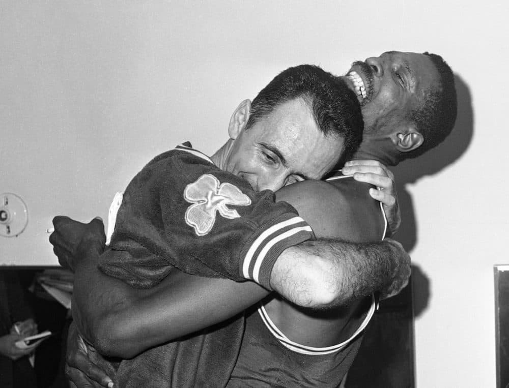 Bob Cousy and Bill Russell celebrate their 1963 NBA title. (Ed Widdis/AP)