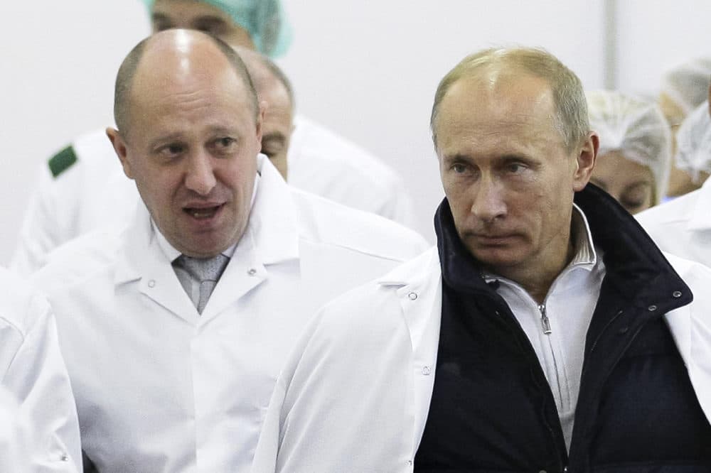 Businessman Yevgeny Prigozhin, left, shows Russian President Vladimir Putin, around his factory which produces school means, outside St. Petersburg, Russia, Sept. 20, 2010. (Alexei Druzhinin/Pool Photo via AP, File)