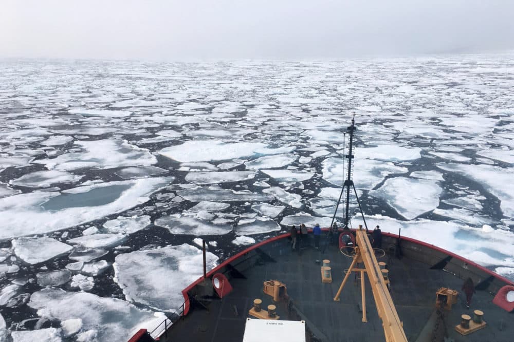 This summer 2018 photo provided by NOAA shows the USCG Icebreaker Healy on a research cruise in the Chukchi Sea of the Arctic Ocean. Scientists are seeing surprising melting in Earth's polar regions at times they don't expect, like winter, and in places they don't expect, like eastern Antarctica. (Devin Powell/NOAA via AP)