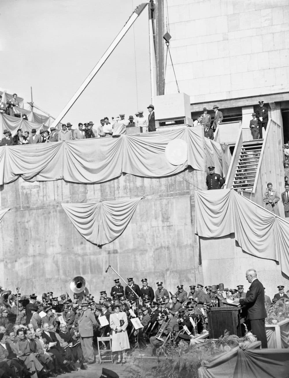 President Harry S. Truman (right), delivers a foreign policy speech at the cornerstone laying ceremony for the United Nations permanent headquarters on Oct. 24, 1949 in New York City. High above musicians is the cornerstone which was lowered into place over a receptacle containing a copy of the U.N. charter and the U.N. declaration of human rights. (AP)
