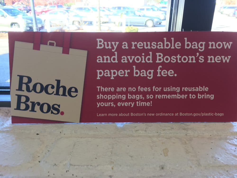 A sign at Roche Bros. warning of the plastic bag ban (Dan Guzman/WBUR)