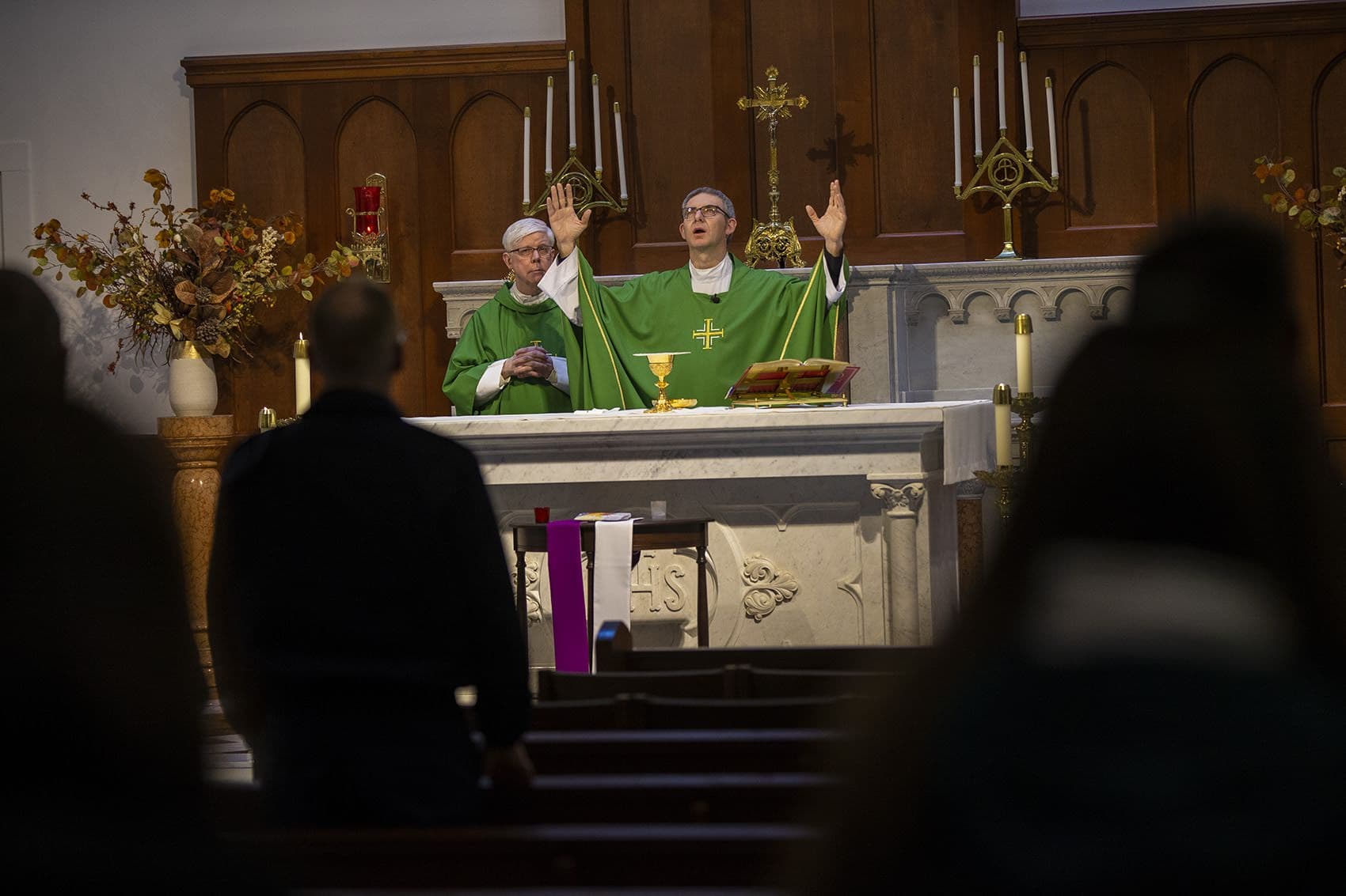 Father Paolo Cumin leads the noon Mass at Shrine of Our Lady of Good Voyage in the Seaport. (Jesse Costa/WBUR)