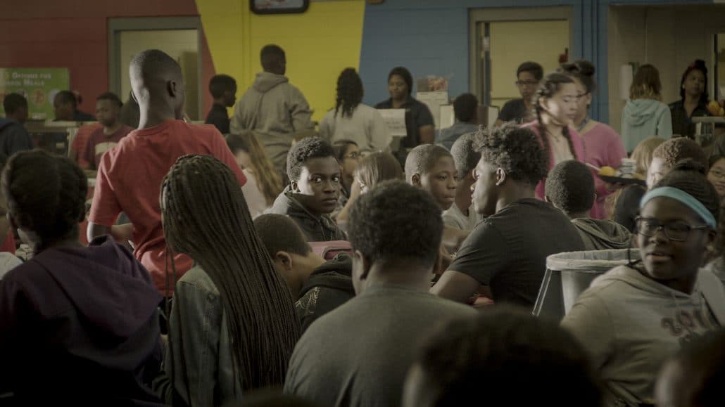 Andrew Bleechington, center facing camera, sits in the school cafeteria. (Courtesy CFI Releasing)