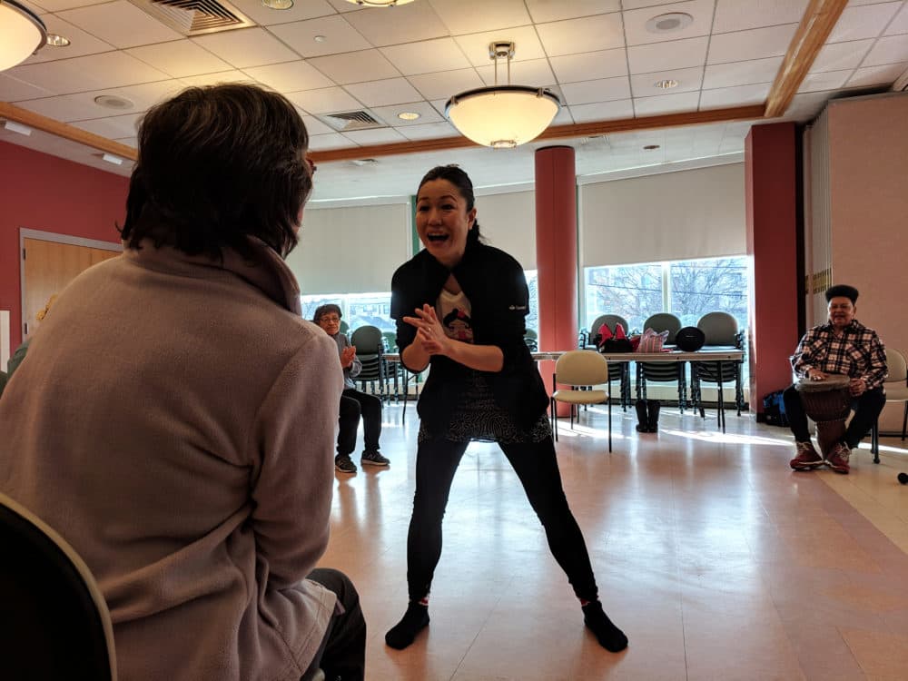 Yosi Karahashi works with Sandra Corsetti at the Cambridge Senior Center. (Jessica Ullian for WBUR)