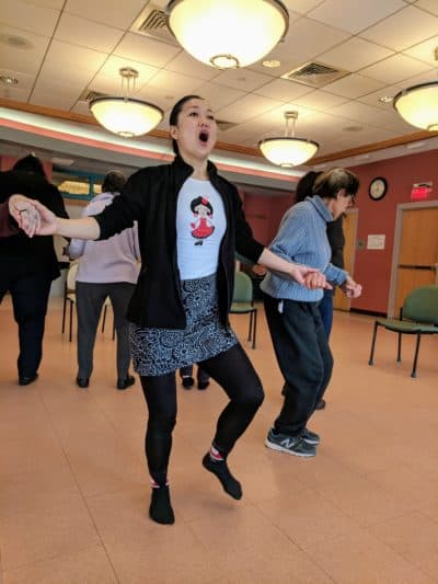 Yosi Karahashi leads her class at the Cambridge Senior Center. (Jessica Ullian for WBUR)