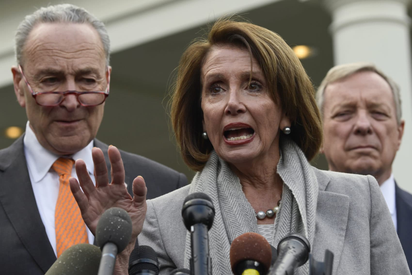 House Speaker Nancy Pelosi of Calif., center, speaks as she stands next to Senate Minority Leader Sen. Chuck Schumer of N.Y., left, and Sen. Dick Durbin, D-Ill., right, following their meeting with President Trump at the White House in Washington, Wednesday, Jan. 9, 2019. (Susan Walsh/AP)