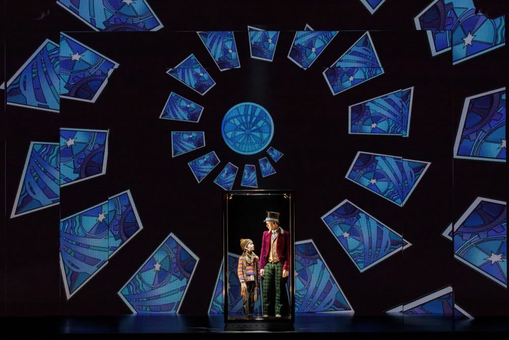 Henry Boshart as Charlie Bucket and Noah Weisberg as Willy Wonka, in "Charlie and the Chocolate Factory." (Joan Marcus/Courtesy of the production)