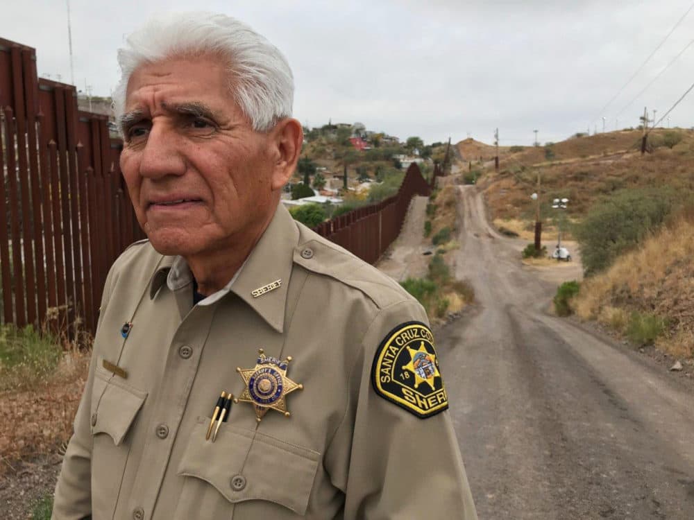 In this Dec. 5, 2017, photo, Santa Cruz County Sheriff Tony Estrada poses for a photo in Nogales, Ariz., on the U.S. side of the international boundary with Nogales, Mexico, where he was born. Estrada is a critic of President Trump's immigration policies and plans for a "big, beautiful" border wall. (Anita Snow/AP)