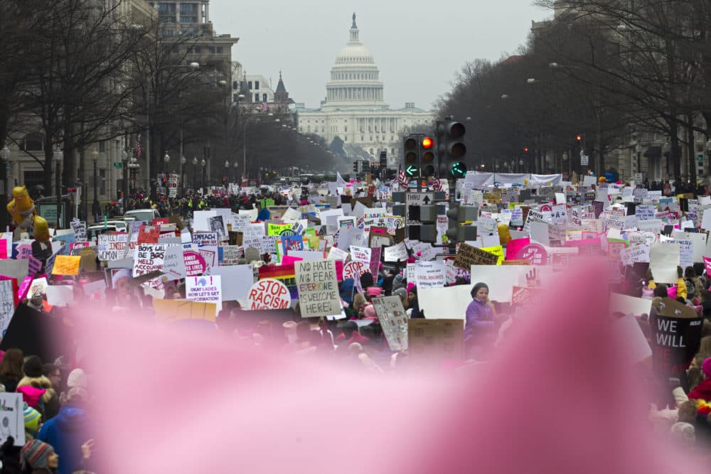 With a pink hat in the foreground, demonstrators march on Pennsylvania Avenue during the Women's March in Washington on Saturday, Jan. 19, 2019. (Jose Luis Magana/AP)