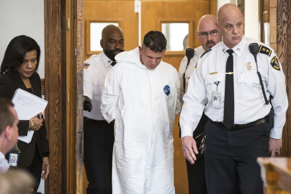 Victor Pena, center, appears at the Charlestown Division of the Boston Municipal Court Jan. 23, 2019. (Aram Boghosian/The Boston Globe via AP Pool)