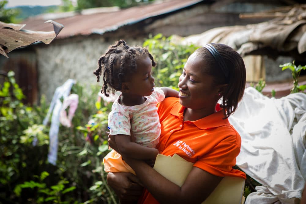 BOUCAN CARRE, HAITI - .
Nurse Asmine Pierre holds Maylove Louis, 14 months, during a home visit in Boucan Carré, Haiti. Louis is four months into the malnutrition program.
(Courtesy Partners In Health)