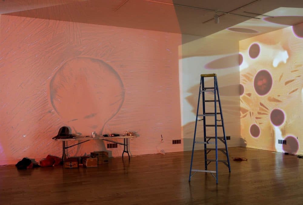 Otto Piene's "Proliferation of the Sun," a projected, multimedia performance from digitized hand-painted glass slides, is installed for an exhibition of Piene's work at the Fitchburg Art Museum. (Hadley Green for WBUR)