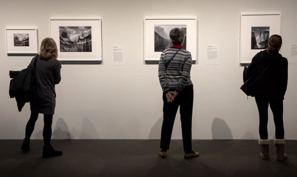 Visitors at the MFA's "Ansel Adams in Our Time" exhibit. (Robin Lubbock/WBUR)