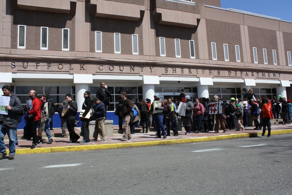 Protesters rally outside the Suffolk County House of Corrections during an April 2014 demonstration against deportations. (Suzanne Hinton via Flickr)