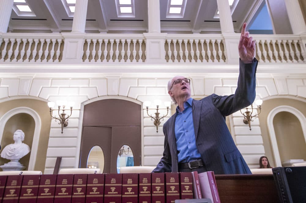 Architect Christos Coios points out some of the details of the Senate chamber renovation to the media. (Jesse Costa/WBUR)