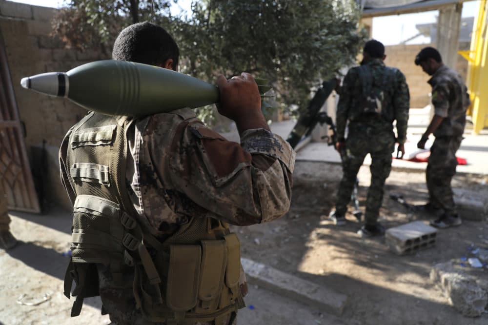 U.S.-backed Syrian Democratic Forces fighters, prepare to fire a mortar shell, at one of the front lines, in Raqqa city, northeast Syria, Thursday, July 27, 2017. (Hussein Malla/AP)