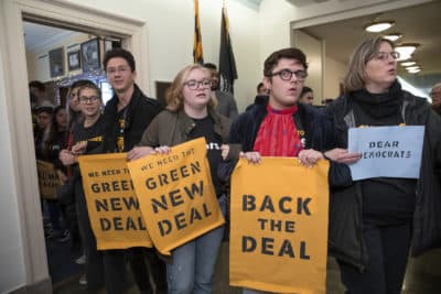 Young environmental activists occupy the office of Rep. Steny Hoyer, D-Md., the incoming majority leader, as they try to pressure Democratic support for a sweeping agenda to fight climate change, on Capitol Hill in Washington, Monday, Dec. 10, 2018. (J. Scott Applewhite/AP)