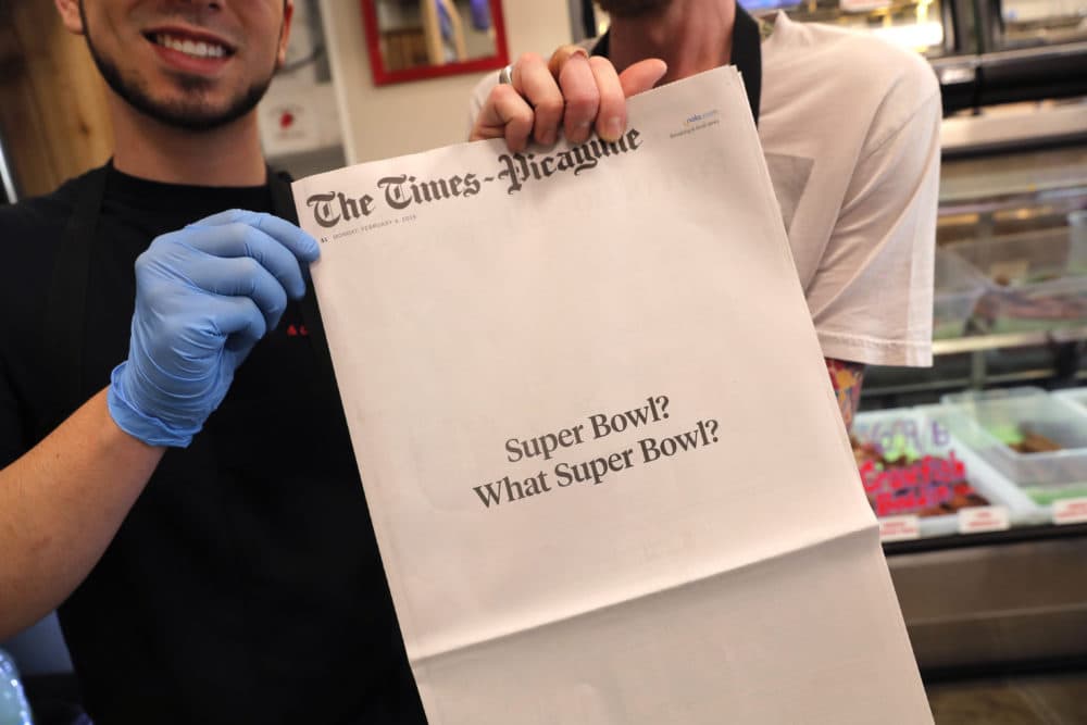Brothers Damien Hanford, right, and Matthew Hanford, hold their copy of the mostly blank front page of the New Orleans Times-Picayune newspaper, at Bergeron Boudin and Cajun Meats, in Harahan, La., Monday, Feb. 4, 2019. The newspaper's nearly blank front page summarized what those in the Big Easy think of the New England Patriots' win over the Rams on Sunday: "Super Bowl? What Super Bowl?" (Gerald Herbert/AP)