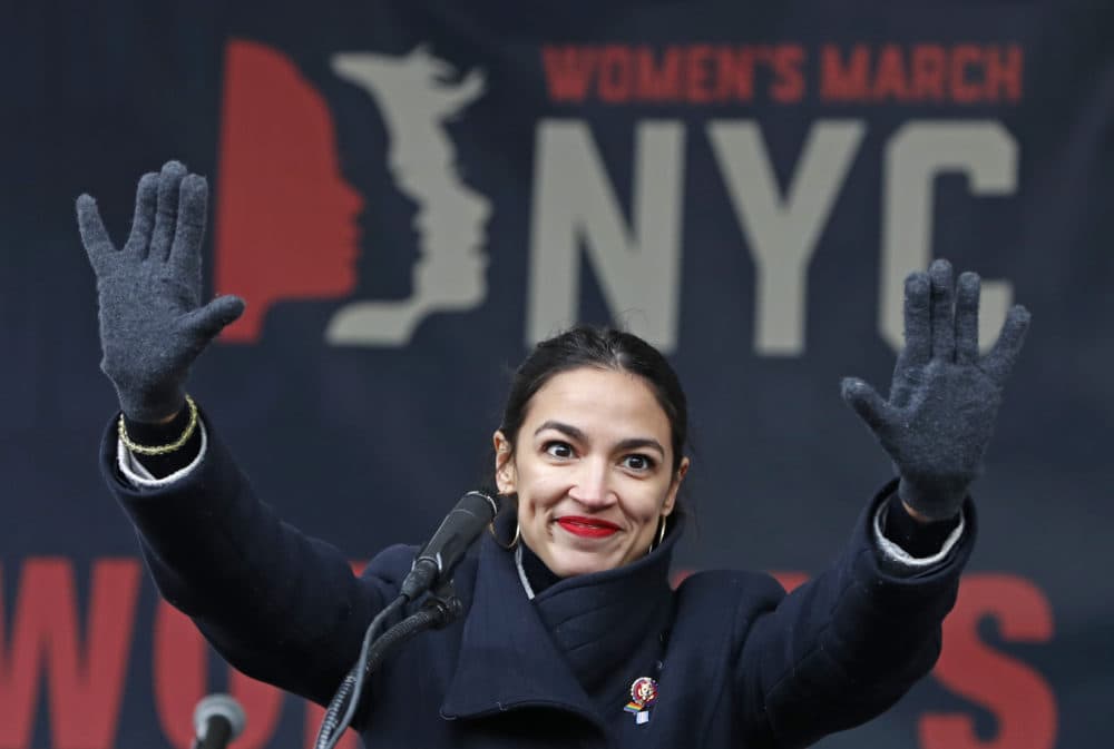 U.S. Rep. Alexandria Ocasio-Cortez waves to the crowd after speaking at Women's Unity Rally in Lower Manhattan in New York. Democrats including Ocasio Cortez of New York and veteran Sen. Ed Markey of Mass.