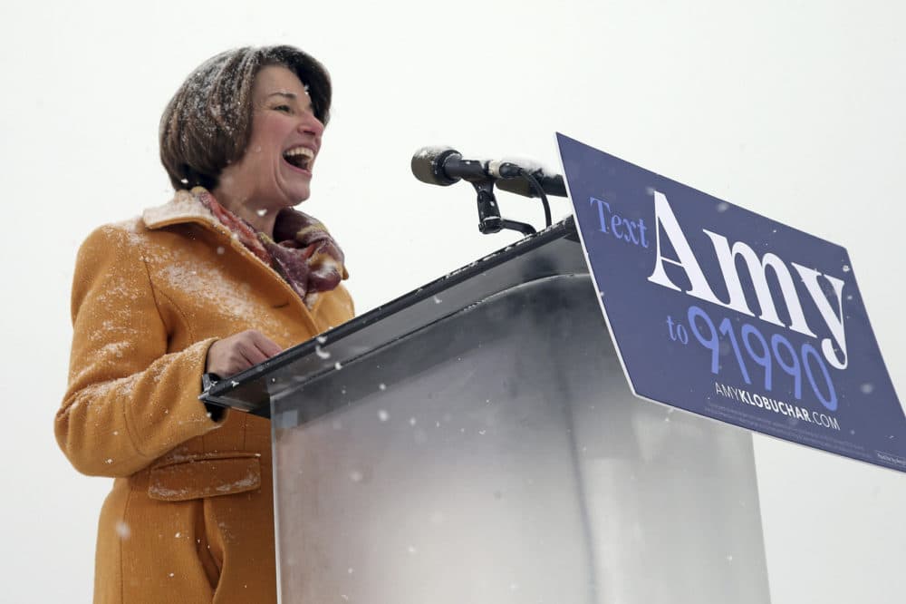 Democratic Sen. Amy Klobuchar, laughs as she addresses a snowy rally where she announced she is entering the race for president Sunday, Feb. 10, 2019, at Boom Island Park in Minneapolis. (Jim Mone/AP)